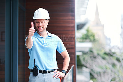 Buy stock photo Portrait of a cheerful engineer posing with his thumbs up outside a building