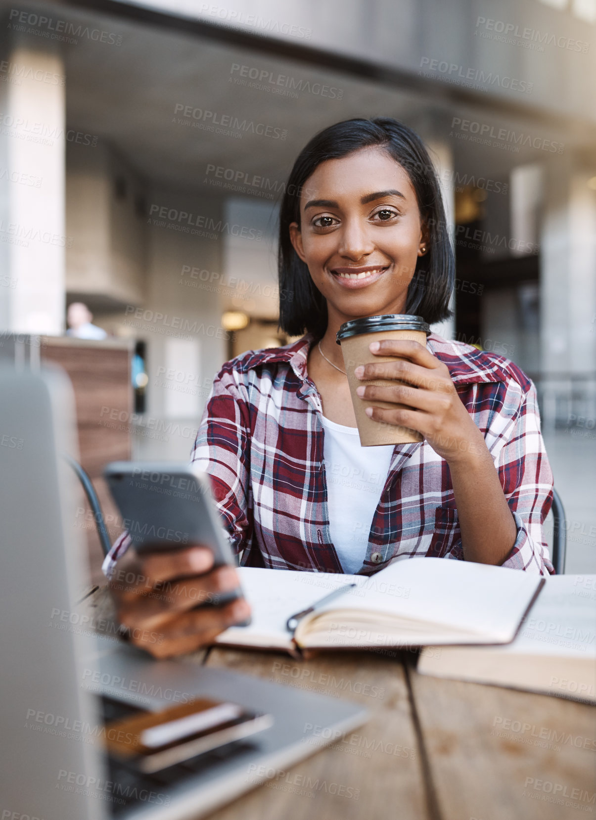 Buy stock photo Cropped portrait of an attractive young female student using her cellphone while sitting outside on campus