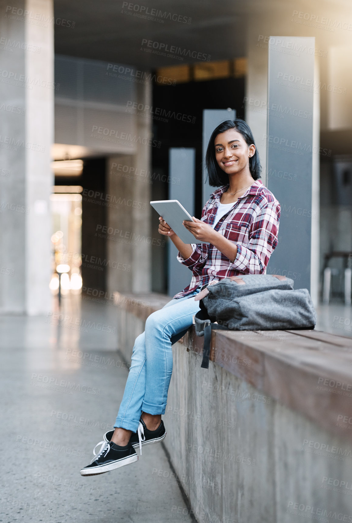 Buy stock photo Girl, college student and tablet at campus in portrait, education or happy to prepare for class. Indian person, notification and elearning app for study, assessment or smile for results at university