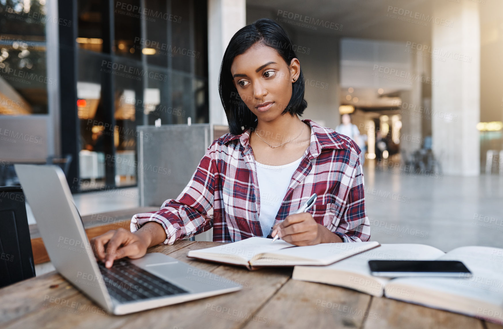 Buy stock photo Girl, laptop and books at campus, outdoor and studying for exam, writing and notes for solution. Person, computer and reading for research, article and learning with info for education at university