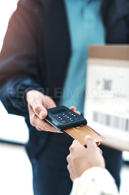 Buy stock photo Shot of an unrecognizable delivery man receiving payment from a female customer for her order