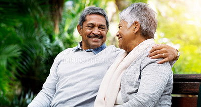 Buy stock photo Park, bench and happy, senior couple outdoors for bonding, commitment or loving relationship. Retirement, marriage and elderly man and woman hug, embrace and relax together in nature for conversation