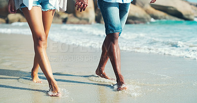 Buy stock photo Ocean, legs and couple walking on beach, honeymoon or anniversary date with people on holiday in California. Connection, trust and support outdoor with respect and loyalty for marriage on the shore