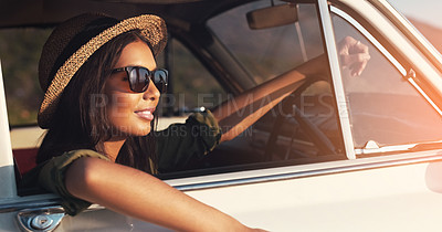 Buy stock photo Cropped shot of an attractive young woman enjoying a roadtrip on a sunny day