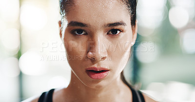 Buy stock photo Cropped portrait of an attractive young sportswoman standing in a gym