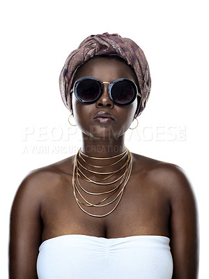 Buy stock photo Portrait of a beautiful young woman striking a pose while wearing sunglasses against a white background