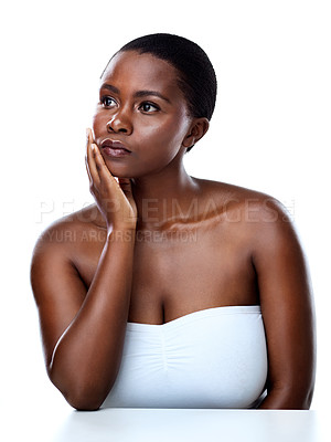 Buy stock photo Black woman, studio and thinking of clear or soft skin, dermatology and white background. Female person, cosmetics and daydream of transformation or skincare results, facial treatment and makeup