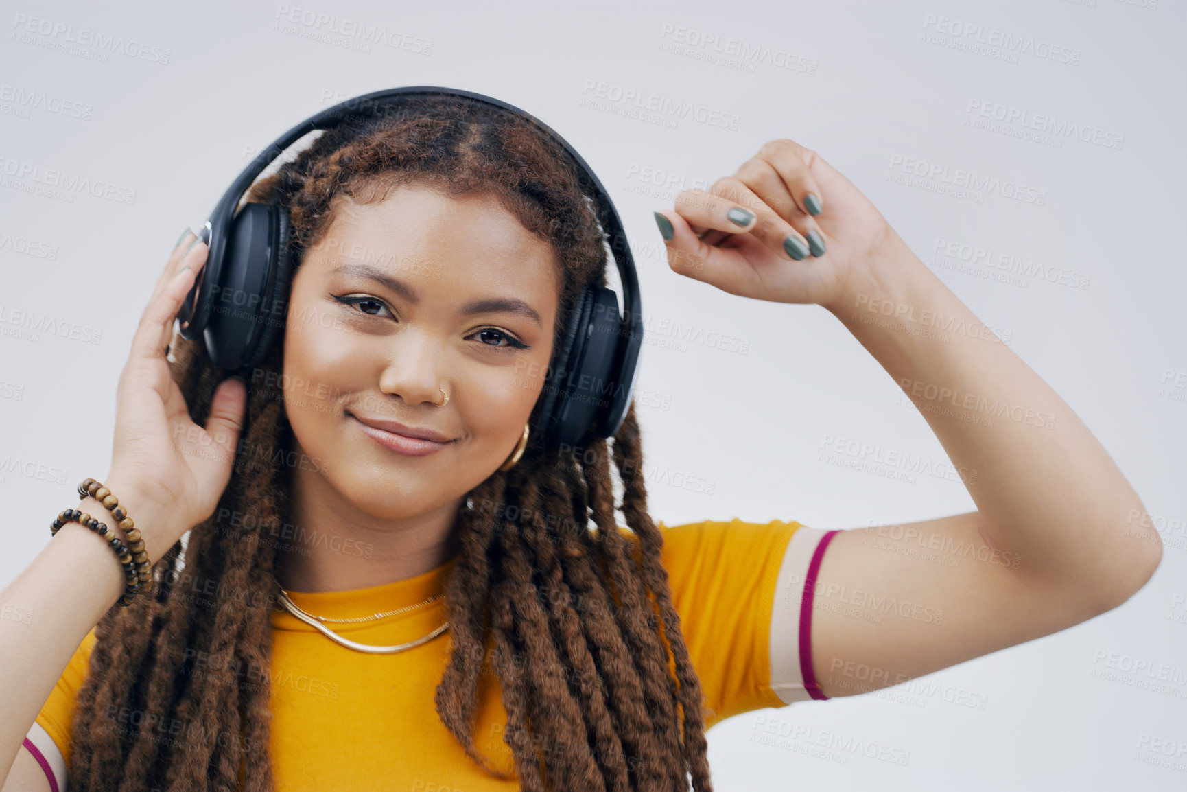 Buy stock photo Woman, backdrop or dance with headphones or hand in closeup, streaming or music with happiness. Female student and celebrate in studio with audio for podcast, happy with sound in California or USA