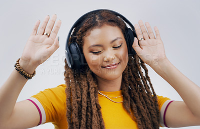 Buy stock photo Woman, studio or celebrate with headphones in zoom for music, streaming or listening with happiness. Female student or dance on backdrop with audio for diploma, happy with interest for study loan
