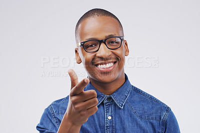 Buy stock photo Portrait, smile and black man pointing at you for decision, selection and face in studio isolated on white background space. Direction, choice and hand gesture of happy person in glasses for support