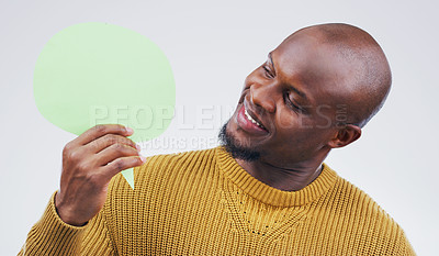 Buy stock photo African man, speech bubble and studio with idea, smile and opinion for social media by background. Gen z guy, poster or paper sign for vote, review and mock up with happiness for ideas, news or chat