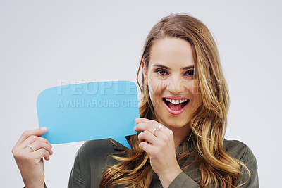 Buy stock photo Happy woman, portrait smile and speech bubble for question, FAQ or social media against a white studio background. Excited female person smiling with shape sign for comment, message or mockup space