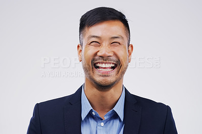 Buy stock photo Happy, laughing and portrait of businessman in a studio with comedy, comic joke or funny story. Happiness, smile and face of an Asian male person with a positive face expression by gray background.