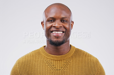 Buy stock photo Portrait, smile and black man with confidence, wellness and casual outfit against grey studio background. Face, male person and guy with happiness, carefree and joyful with mockup, beauty and fashion