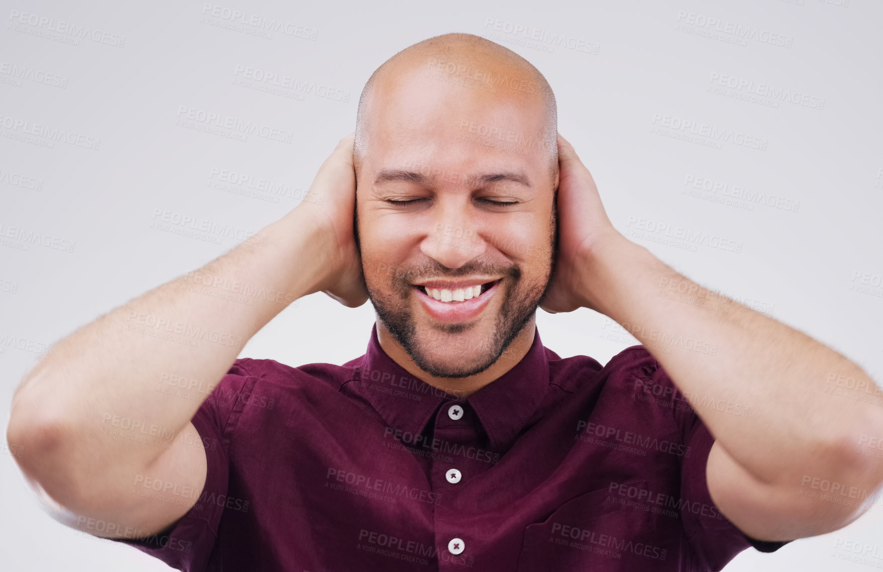 Buy stock photo Man, smile and cover ears in studio for peace of mind, noise and calm. African person, happy and not listening to sound for silence, relax and social anxiety on isolated white background with mockup