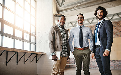 Buy stock photo Cropped portrait of three professional businessmen posing together in their office