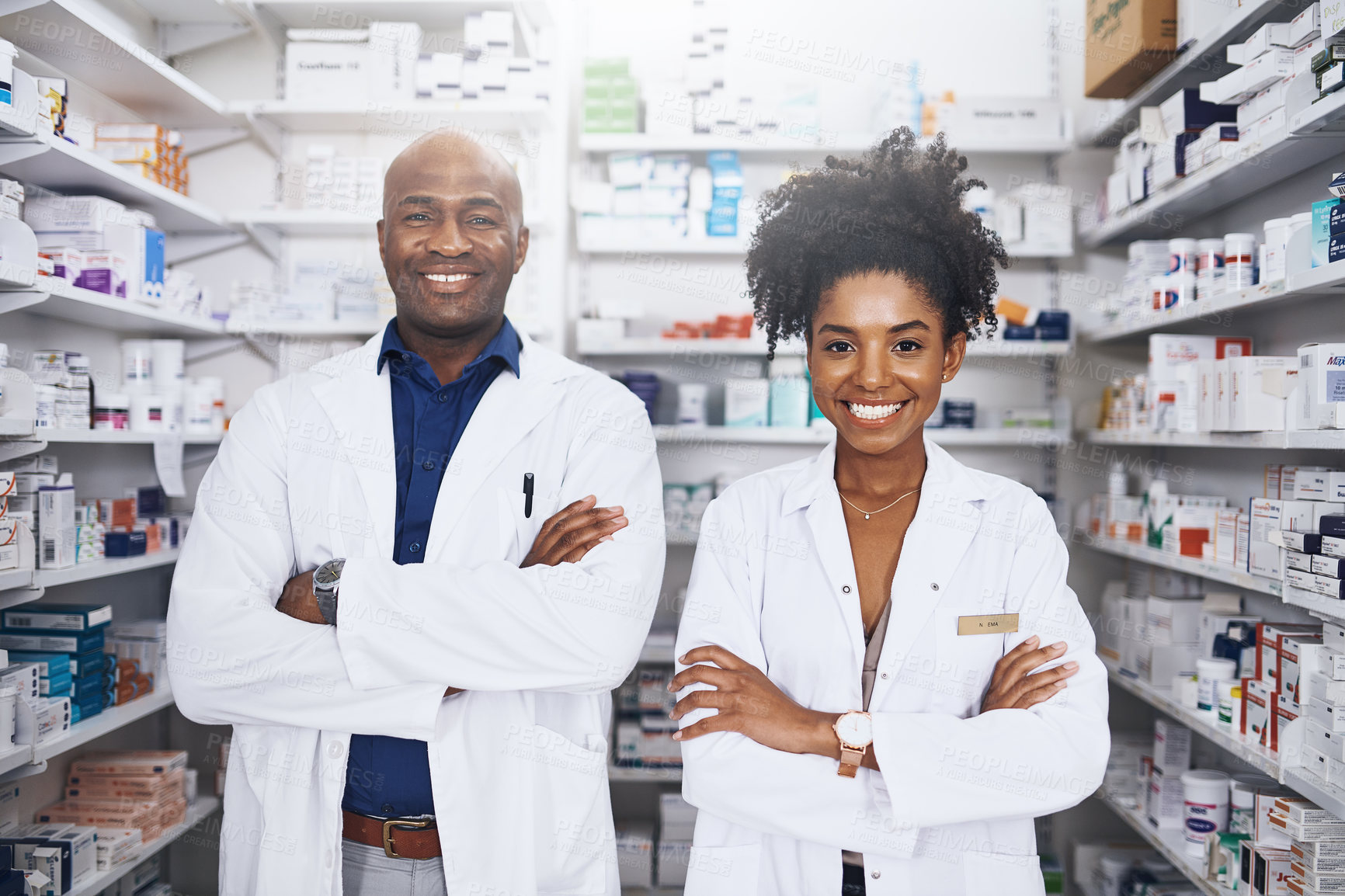 Buy stock photo Portrait of two pharmacist standing with their arms crossed