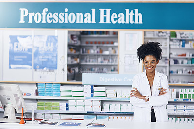 Buy stock photo Portrait of a female pharmacist standing with her arms crossed in a chemist