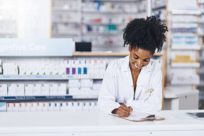Buy stock photo Cropped shot of a confident young woman working as a pharmacist in a chemist