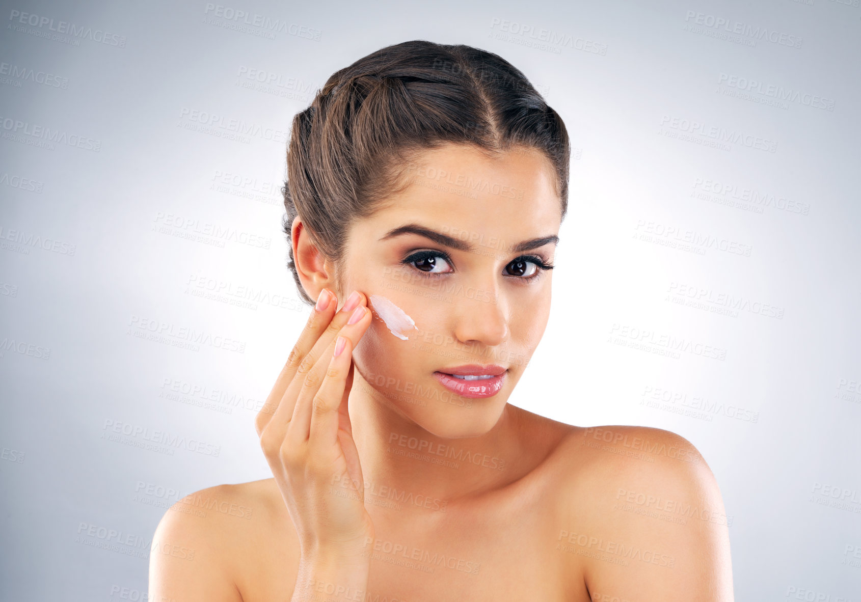 Buy stock photo Skincare, portrait and woman in studio with lotion, cosmetics and make up foundation. Dermatology, female person and facial care on gray background with moisturizer, cream and treatment for soft skin