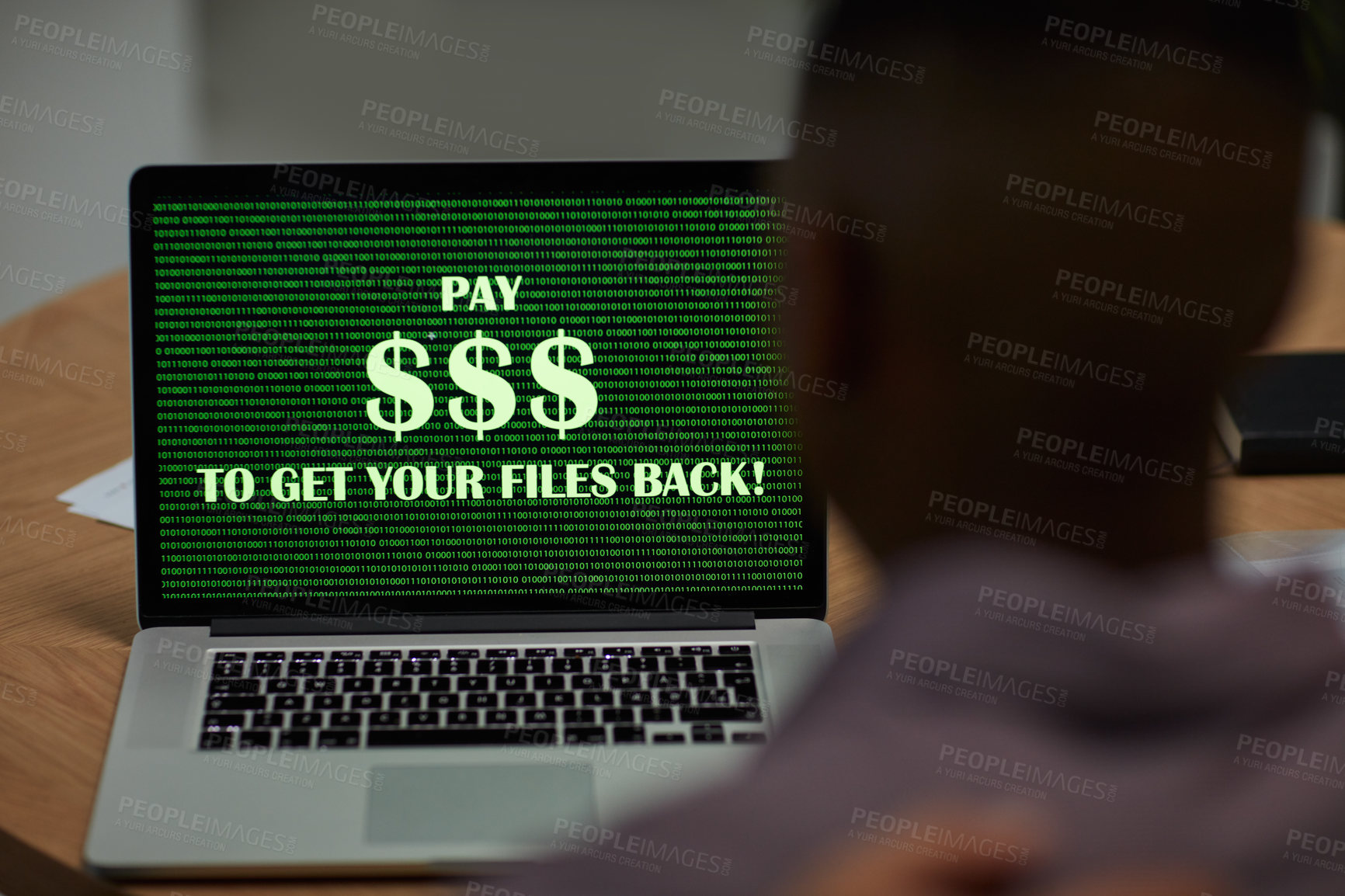 Buy stock photo Shot of a businessman using a laptop with the words “pay $$$ to get your files back” on the screen