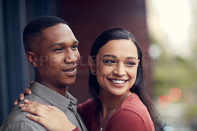 Buy stock photo Shot of a happy young couple sharing a romantic moment together