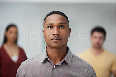Buy stock photo Portrait of a group of confident young businesspeople working in a modern office