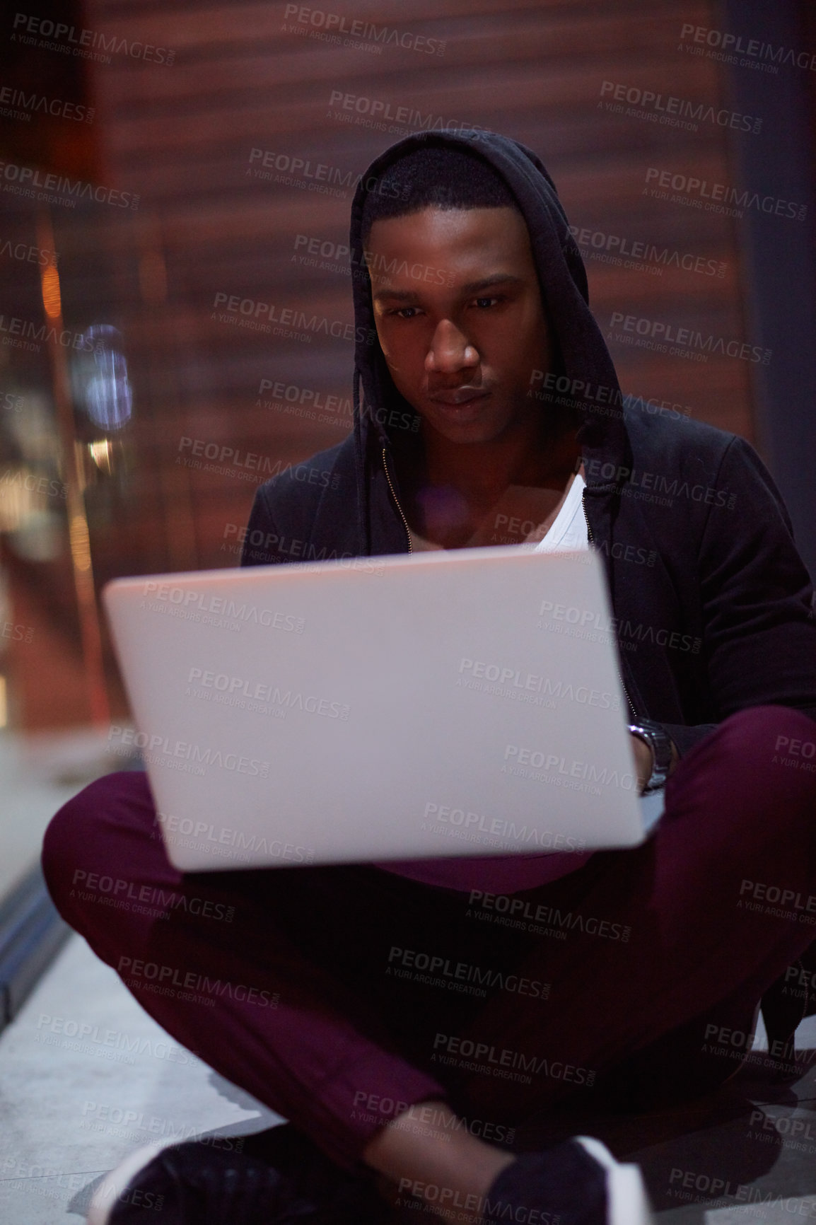 Buy stock photo Shot of a young hacker using a laptop