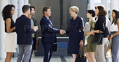Buy stock photo Cropped shot of two businesspeople shaking hands during a meet and greet