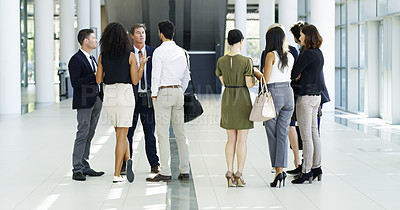 Buy stock photo Full length shot of a group of businesspeople standing in their workplace lobby