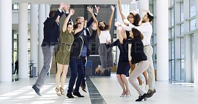 Buy stock photo Full length shot of a group of businesspeople celebrating in the workplace