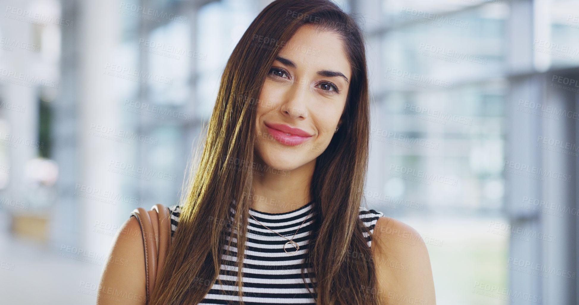 Buy stock photo Cropped shot of a confident young businesswoman working in a modern office