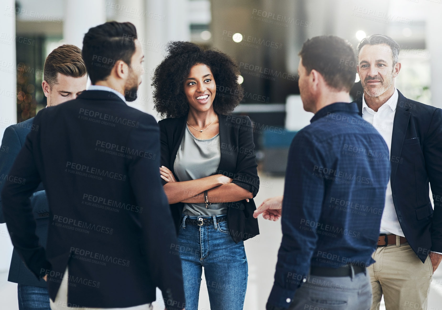 Buy stock photo Shot of a group of businesspeople having a discussion together at work during the day