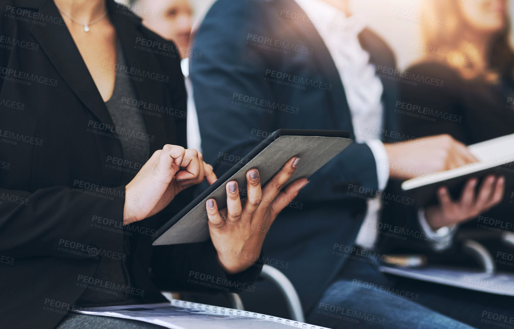 Buy stock photo Shot of a group of businesspeople sitting in the conference room during a seminar