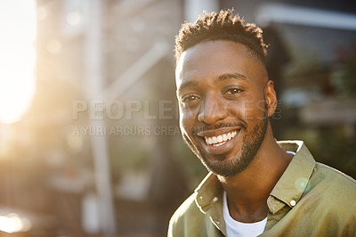Buy stock photo Cropped portrait of a handsome young man chilling at an outdoor coffee shop