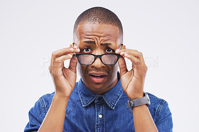 Buy stock photo Black man, giveaway or promotion in studio portrait for surprise at announcement, deal or good news. Male person, doubt or confused with information, communication or drama against white background