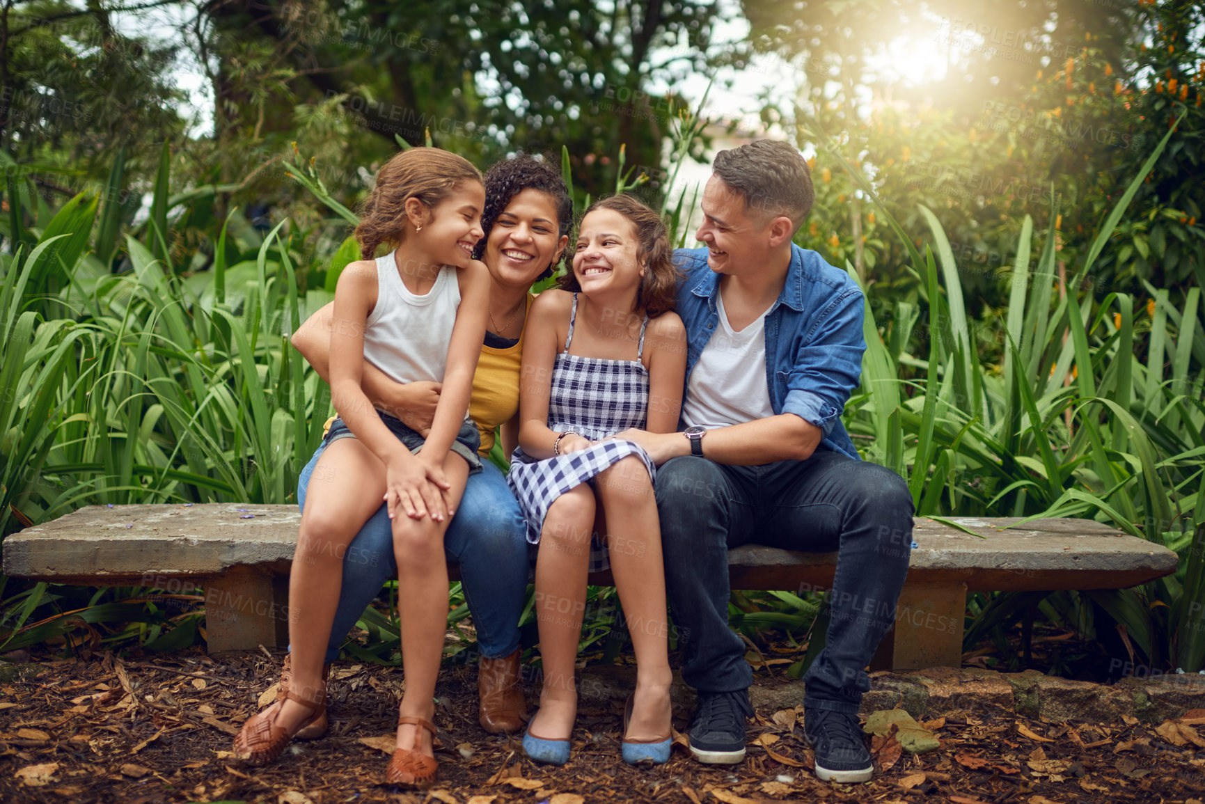 Buy stock photo Laughing, love or happy family on bench in park with smile or kids in nature garden for bonding together. Parents, dad or mom in home with care, hug or children siblings on holiday vacation in France