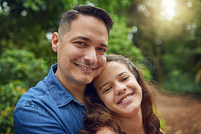 Buy stock photo Cropped portrait of a happy father spending time with his daughter at the park