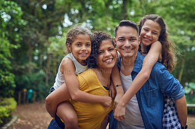 Buy stock photo Cropped portrait of a happy family spending some time together at the park