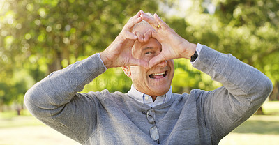 Buy stock photo Portrait, park and senior man with heart hands, happiness and support with review, retirement or relax. Face, mature male person or old guy with symbol for love, outdoor or happy with icon and nature