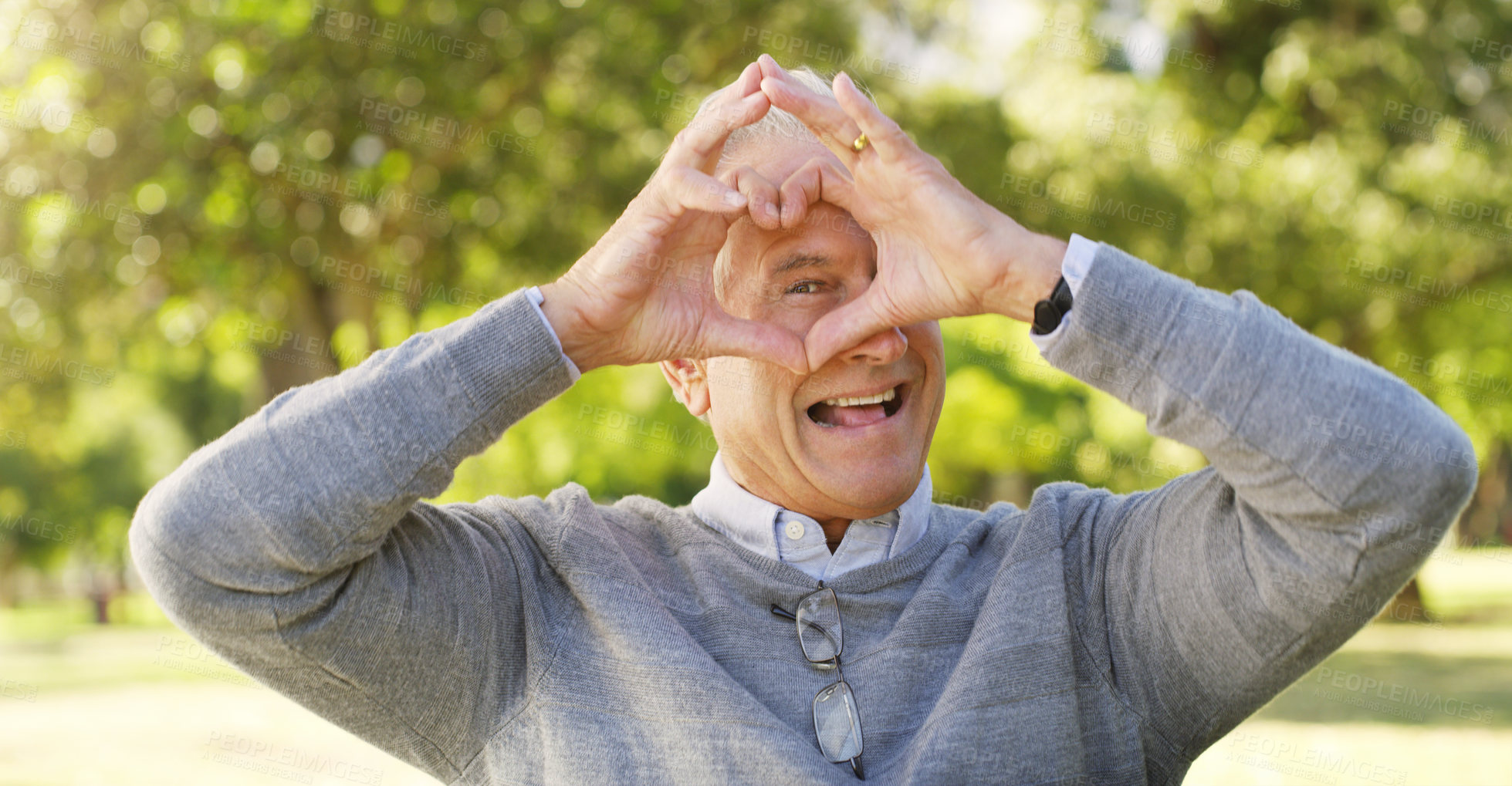 Buy stock photo Portrait, park and senior man with heart hands, happiness and support with review, retirement or relax. Face, mature male person or old guy with symbol for love, outdoor or happy with icon and nature