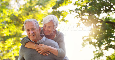 Buy stock photo Senior couple, piggy back and happy outdoor at a park with love, care and support. A elderly man and woman in nature for a fun walk, quality time and healthy marriage or retirement while playful