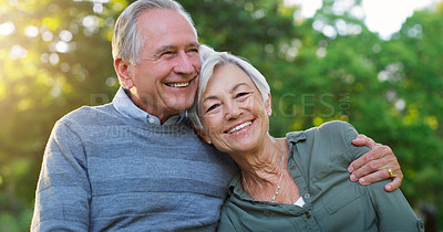 Buy stock photo Love, portrait and senior couple in a garden together hugging with care, happiness and romance. Smile, nature and elderly man and woman in retirement embracing while sitting in an outdoor green park.