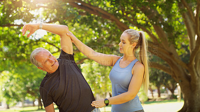Buy stock photo Fitness, trainer and mature man in nature, stretch and wellness for exercise. Park, training and instructor for health and workout in forest, female physiotherapist and healthcare for flexibility