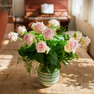 Buy stock photo Closeup of bouquet of pink roses in a vase, flowers and nature on living room table, gift for romance or friendship. Plant, botanical and symbol of love, natural and floral arrangement at home