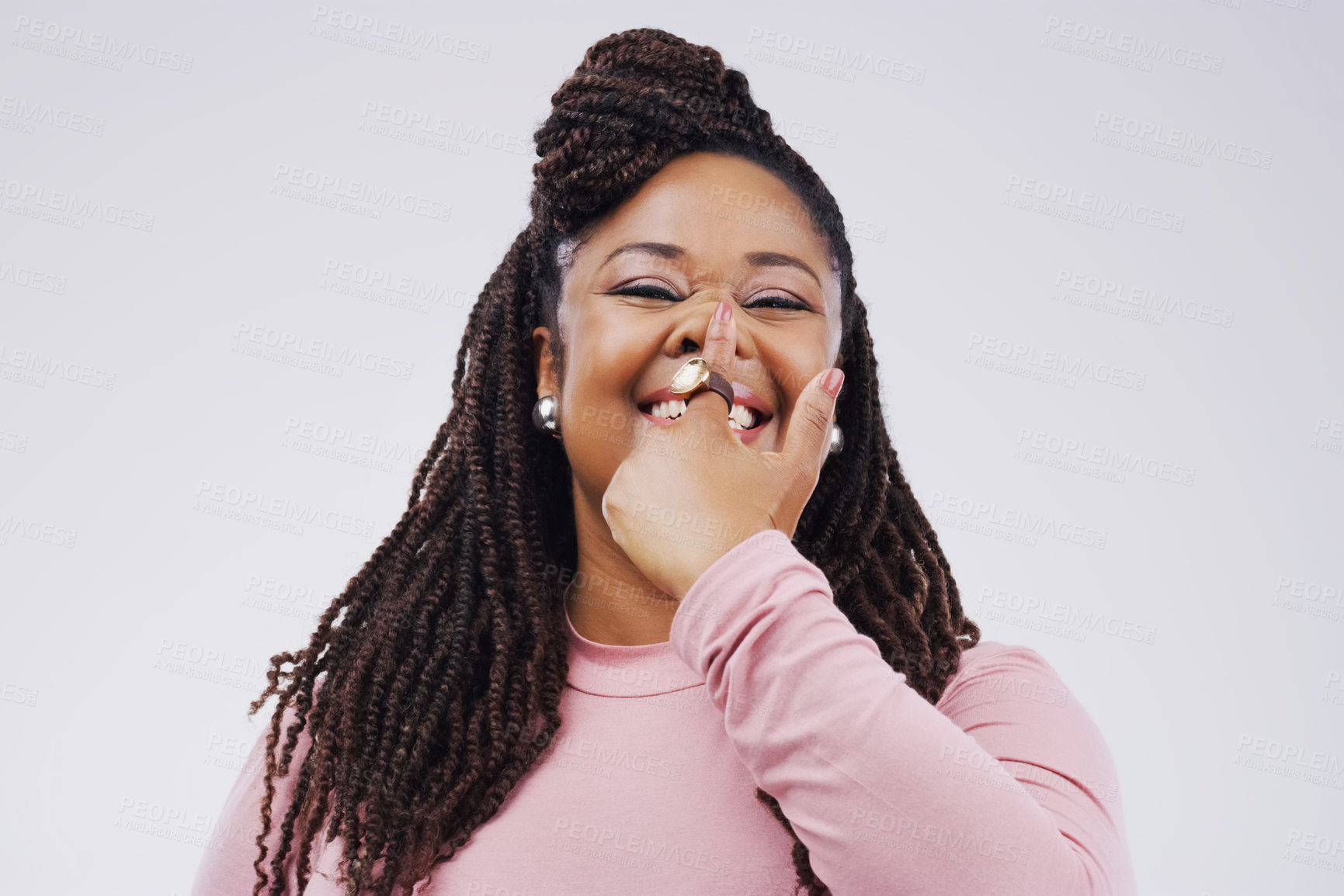 Buy stock photo Portrait, funny face and finger on nose with a black woman in studio on a gray background looking silly or goofy. Comedy, comic and nostril with a crazy young female person joking for fun or humor