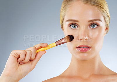 Buy stock photo Girl, studio and confident with makeup brushes for beauty and cosmetics in gray background. Female person, aesthetics and satisfied on portrait with tools or kit for grooming, foundation and glow