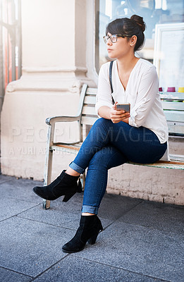 Buy stock photo Woman, phone and bench in city for thinking, professional and street for morning networking. Female person, online and perspective on news update in town, communication app and outdoor for reflection