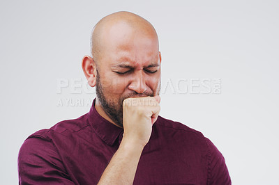 Buy stock photo Studio shot of a handsome young man coughing against a grey background