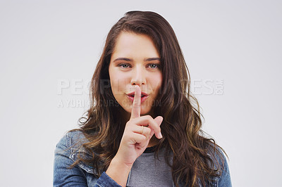 Buy stock photo Model, portrait and finger with rumor, studio and silence for mystery announcement. Woman, gossip and hush with secret, whisper and gesture for news or noise with confidential on white background